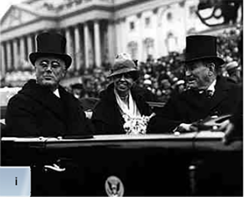 President Roosevelt riding in a car with two others